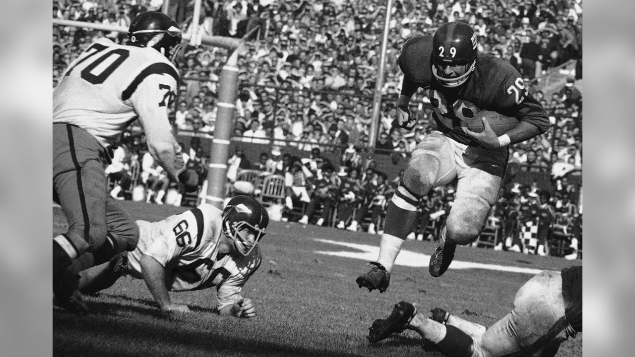 Washington Redskins defensive captain Sam Huff poses in front of