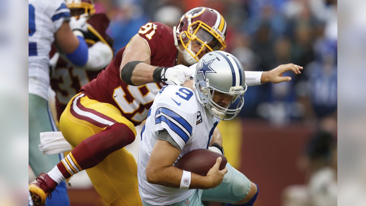 Washington Redskins defensive end Adam Carriker (94) talks with outside  linebacker Ryan Kerrigan (91) during the third quarter of an NFL football  game against the Miami Dolphins, Sunday, Nov. 13, 2011, in