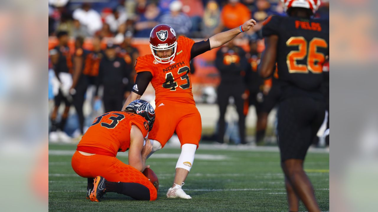 North defensive end John Cominsky of Charleston (5) tries to get around  South offensive tackle Dennis Daley of South Carolina (78) during the  second half of the Senior Bowl college football game