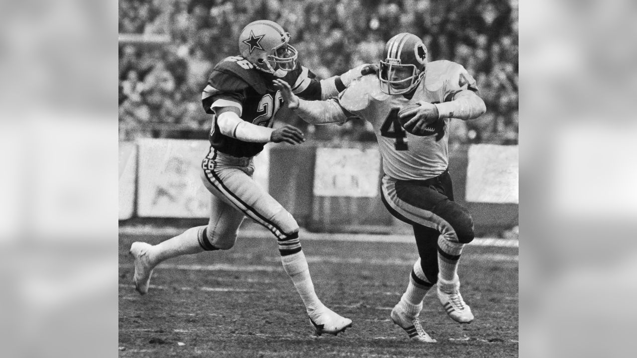 December 31, 1972 - Washington, District of Columbia, United States of  America - Dallas Cowboys quarterback Roger Staubach (12) is hit just as he  releases the ball by Washington Redskins right defensive