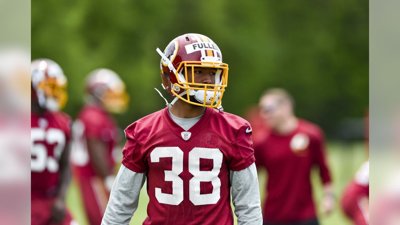 Washington Commanders cornerback Kendall Fuller (29) secures an