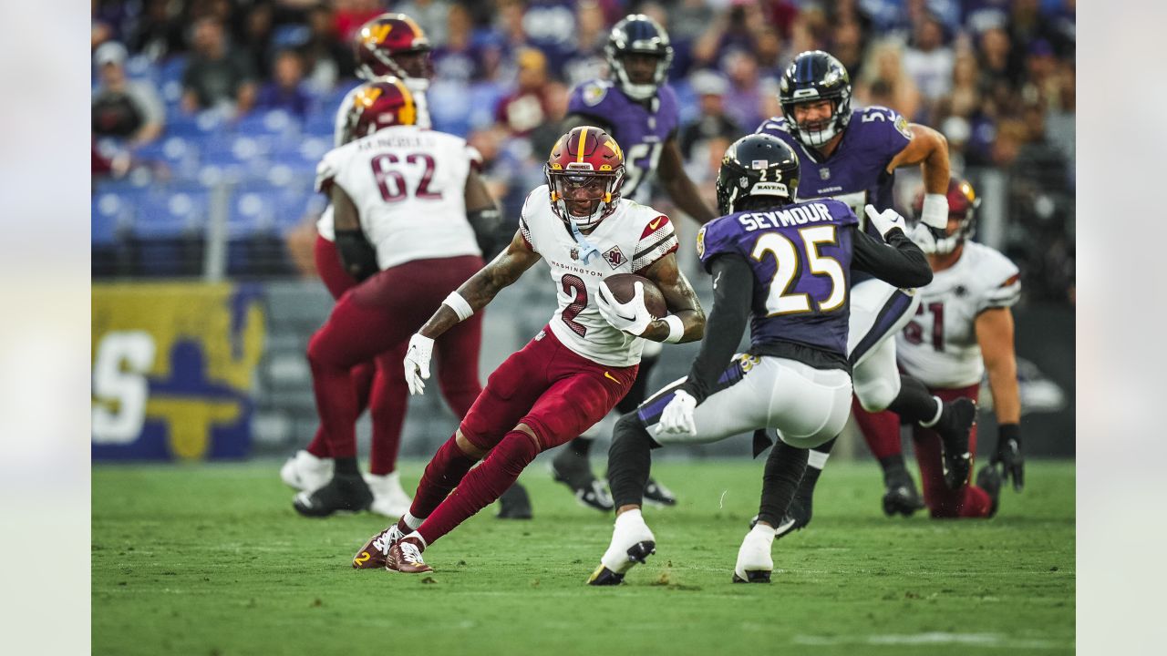 Washington Commanders quarterback Sam Howell (14) throws the ball during  the second half of a NFL preseason football game against the Baltimore  Ravens, Saturday, Aug 27, 2022, in Baltimore. (AP Photo/Terrance Williams