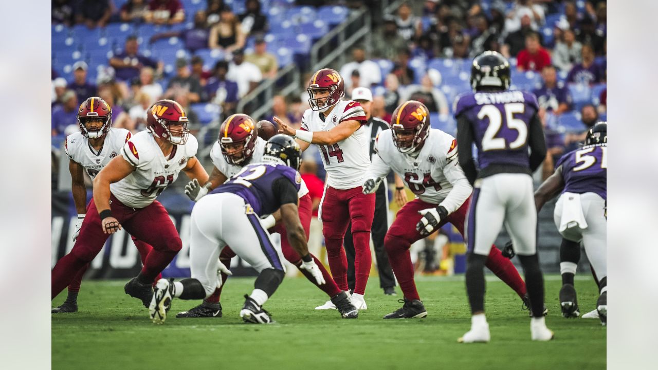 Washington Commanders quarterback Sam Howell (14) throws the ball during  the second half of a NFL preseason football game against the Baltimore  Ravens, Saturday, Aug 27, 2022, in Baltimore. (AP Photo/Terrance Williams