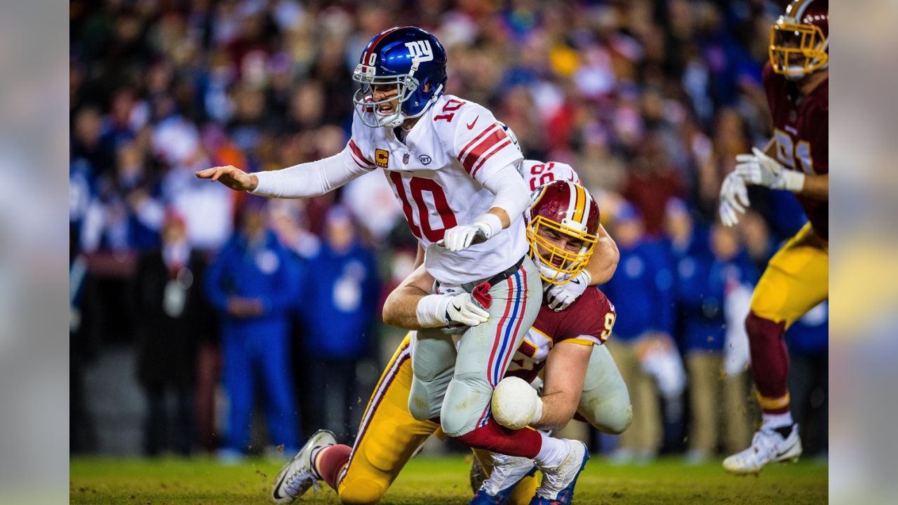 Washington Redskins outside linebacker Ryan Kerrigan (91) sacks New England  Patriots quarterback Tom Brady (12) during