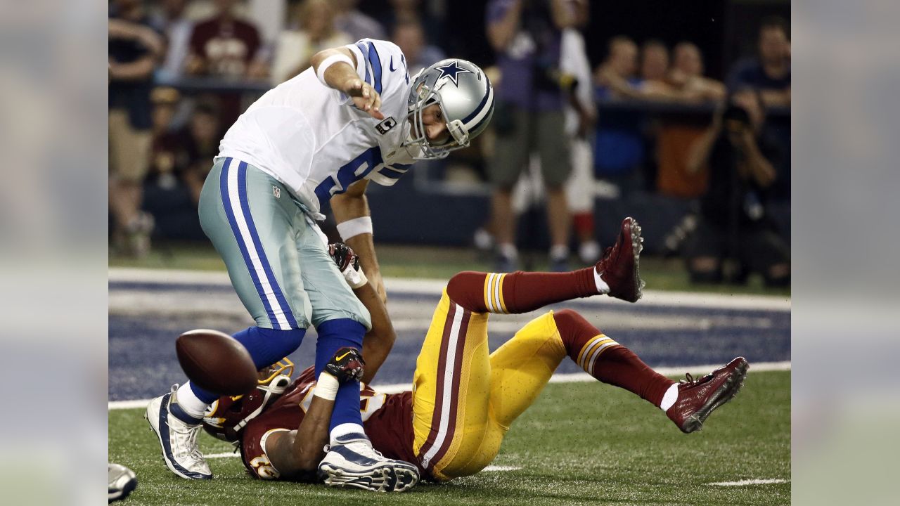 December 31, 1972 - Washington, District of Columbia, United States of  America - Dallas Cowboys quarterback Roger Staubach (12) is hit just as he  releases the ball by Washington Redskins right defensive