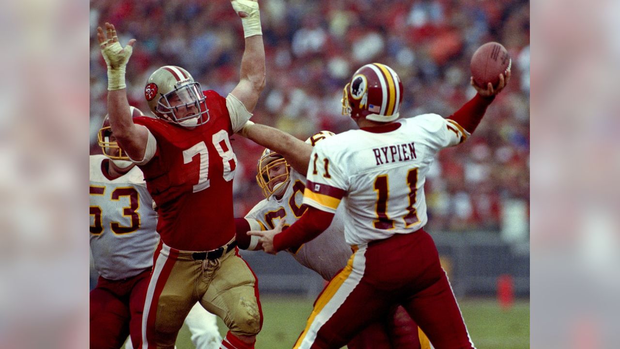 San Francisco, California, USA. 21st Nov, 1988. San Francisco 49ers vs  Washington Redskins at Candlestick Park Monday, November 21, 1988. 49ers  beat Redskins 37-21. San Francisco 49er quarterback Joe Montana passes down