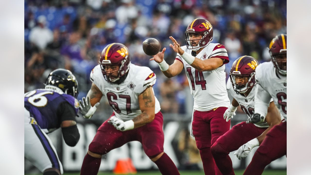 Washington Commanders quarterback Sam Howell (14) throws the ball during  the second half of a NFL preseason football game against the Baltimore  Ravens, Saturday, Aug 27, 2022, in Baltimore. (AP Photo/Terrance Williams