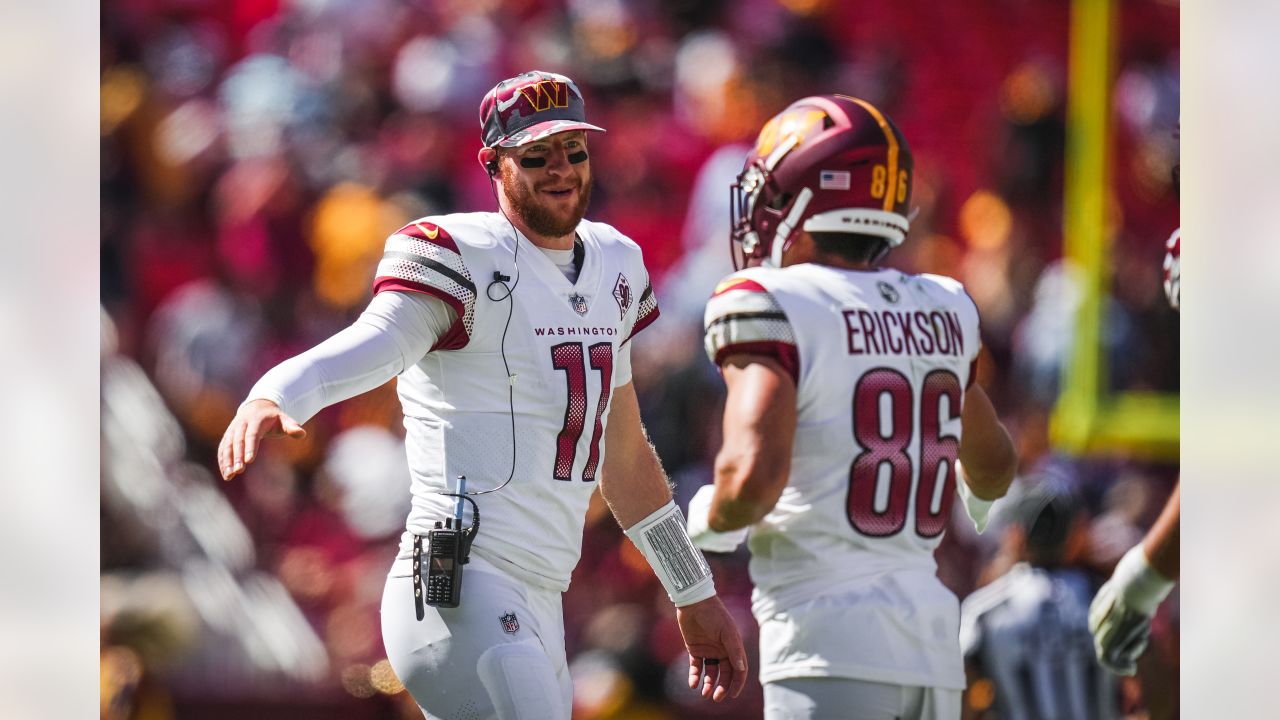 Landover, United States. 13th Aug, 2022. Washington Commanders quarterback  Carson Wentz (11) completes a drill before NFL Preseason game between the  Carolina Panthers vs the Washington Commanders at FedEx Field in Landover