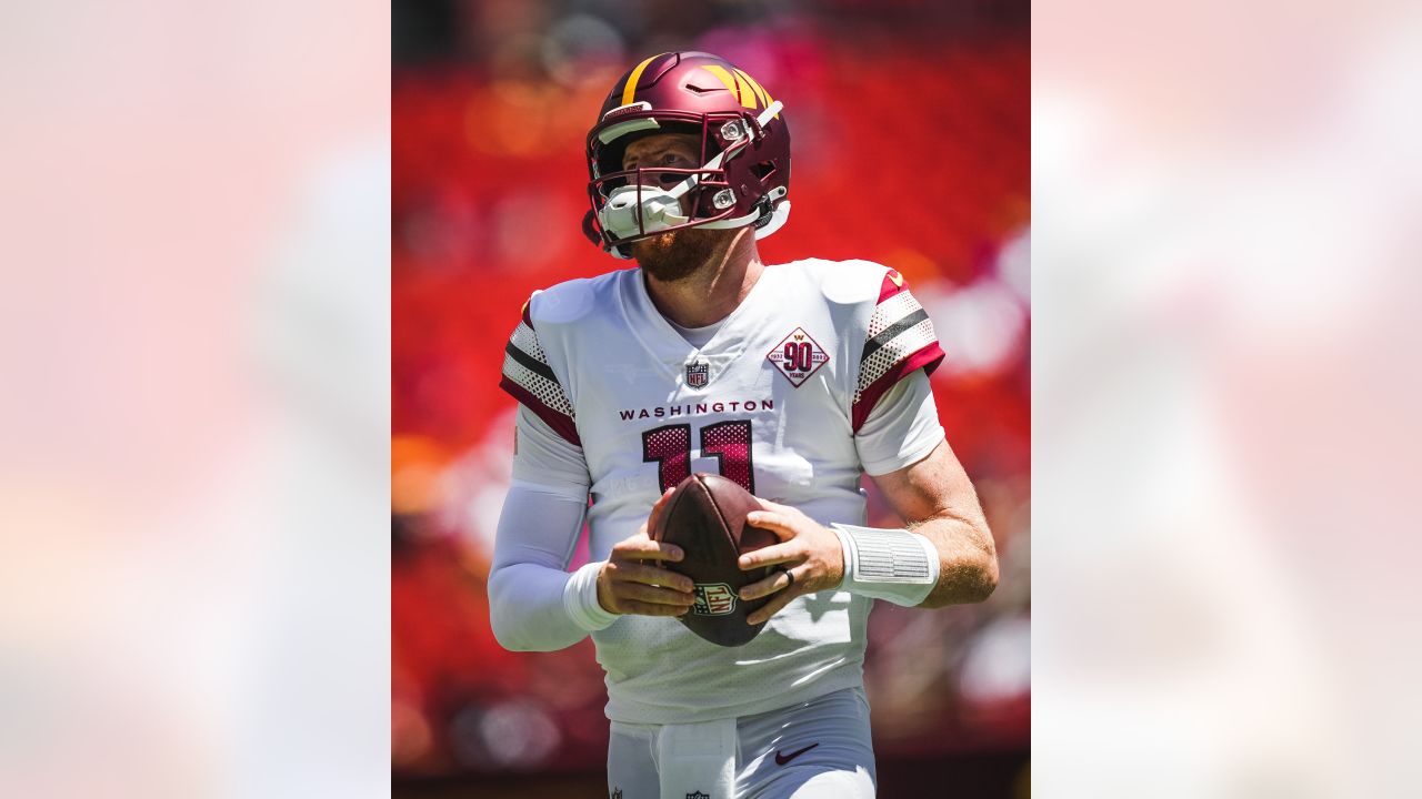 Washington Commanders quarterback Carson Wentz (11) in action during the  first half of a preseason NFL football game against the Carolina Panthers,  Saturday, Aug. 13, 2022, in Landover, Md. (AP Photo/Nick Wass