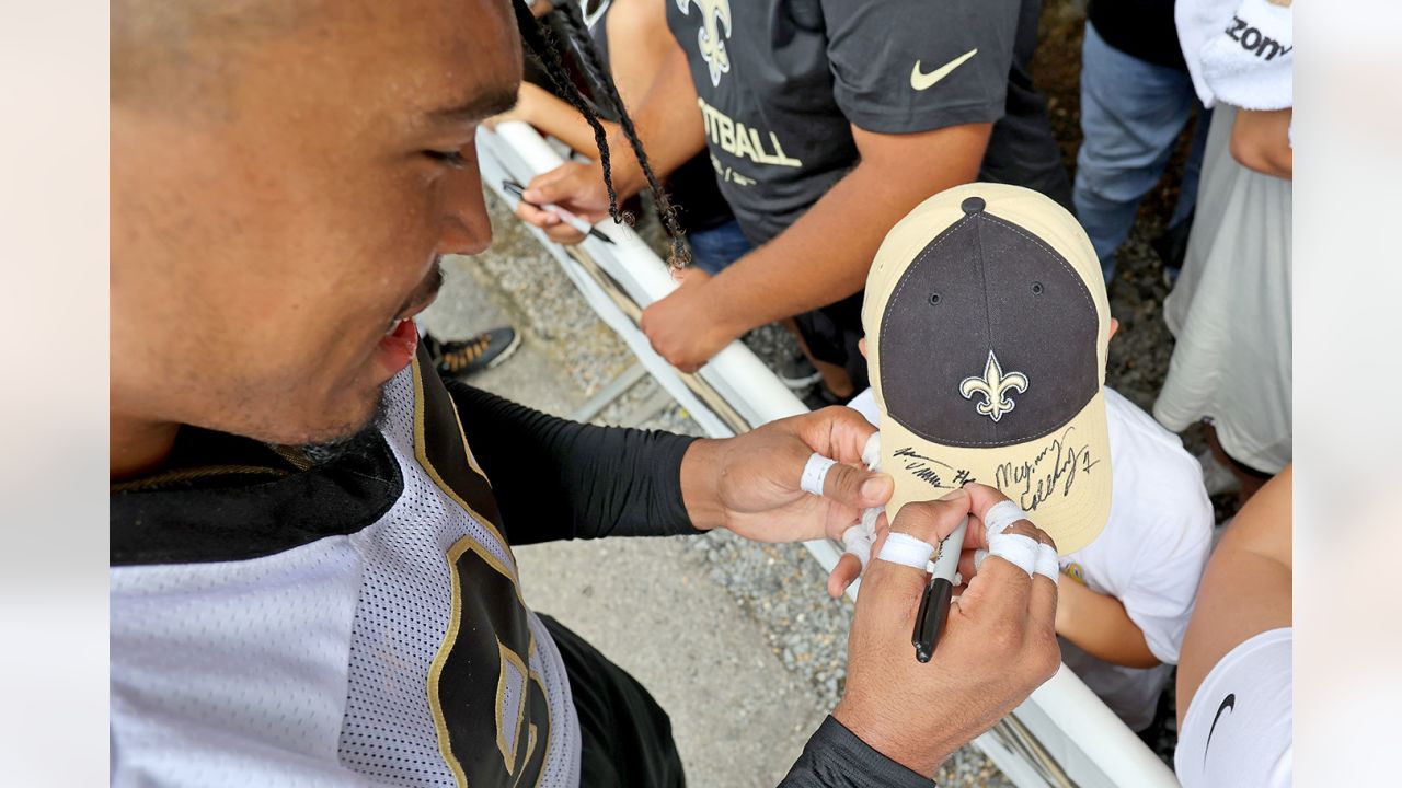 NEW ORLEANS, LA - DECEMBER 27: New Orleans Saints quarterback Ian Book (16)  fakes a handoff to New Orleans Saints running back Mark Ingram (14) during  first half action during the football