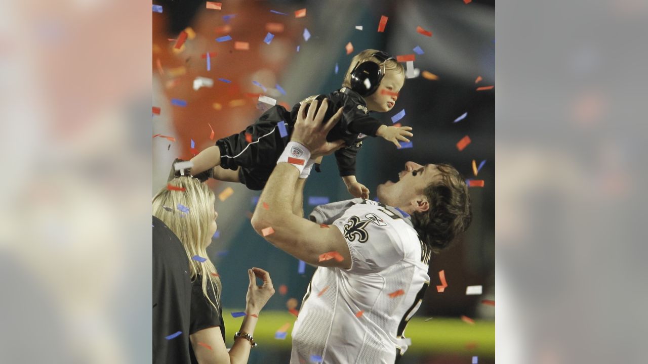 New Orleans Saints quarterback Drew Brees (9) celebrates with his son  Baylen in the confetti-filled air following Super Bowl XLIV at Sun Life  Stadium in Miami Gardens, Fla. Brees' son is wearing