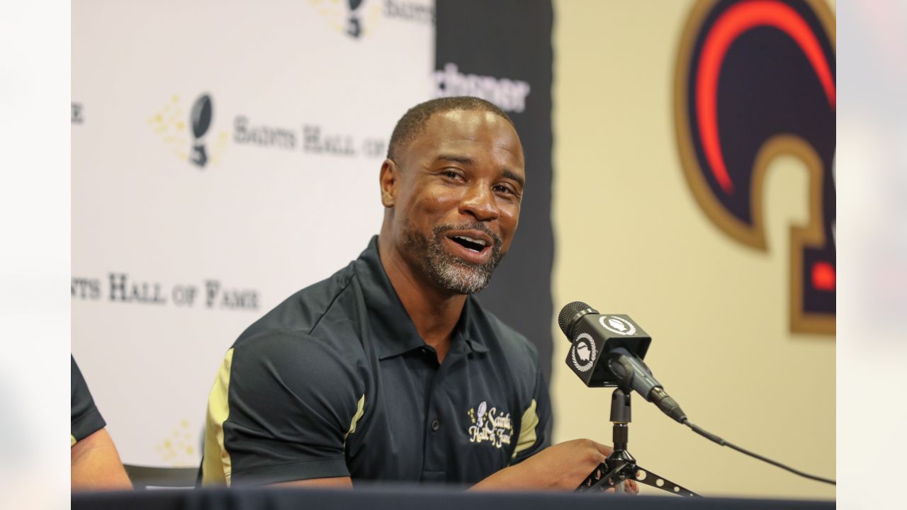 New Orleans Saints corner back Jabari Greer holds his children