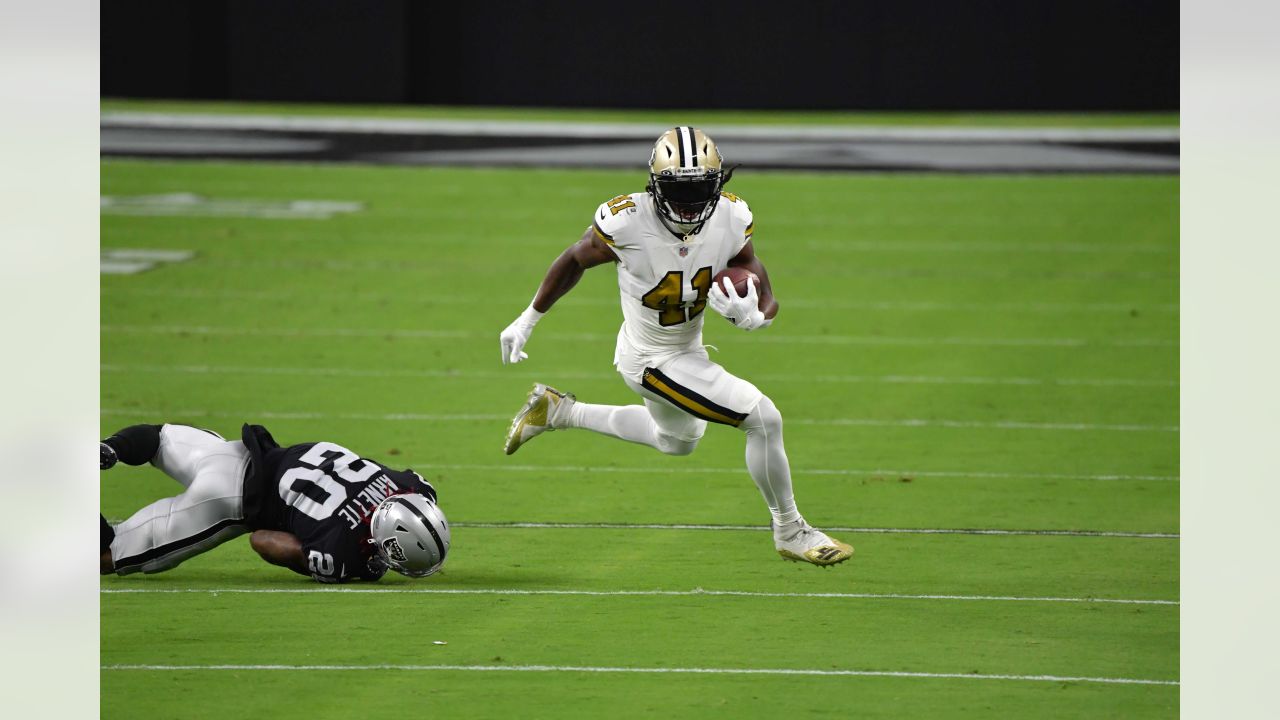 Alvin Kamara of the New Orleans Saints runs with the ball during