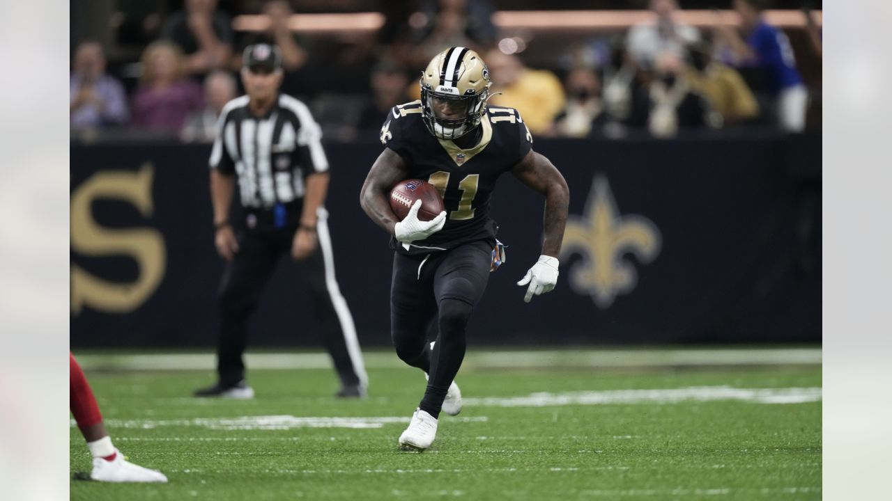 New Orleans Saints' Deonte Harris (11) runs back a punt against the Tampa  Bay Buccaneers during …