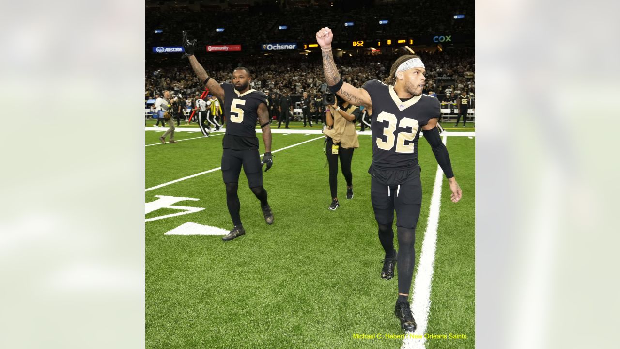 A general view of New Orleans Saints' players warming up ahead of