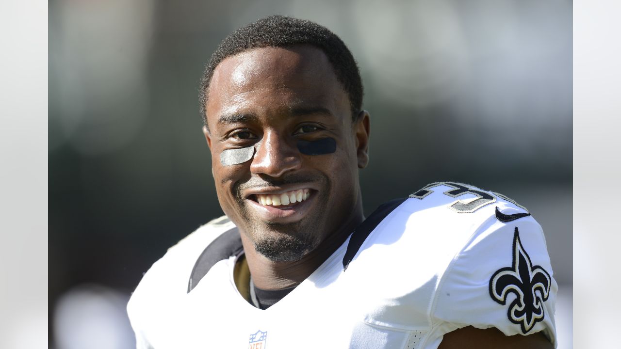 Reggie Bush, wearing a Will Smith jersey, leads Saints onto field