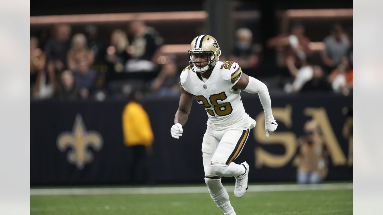 New Orleans Saints cornerback P.J. Williams (26) runs with the ball after  an interception during the first half of an NFL football game against the  New England Patriots, Sunday, Sept. 26, 2021