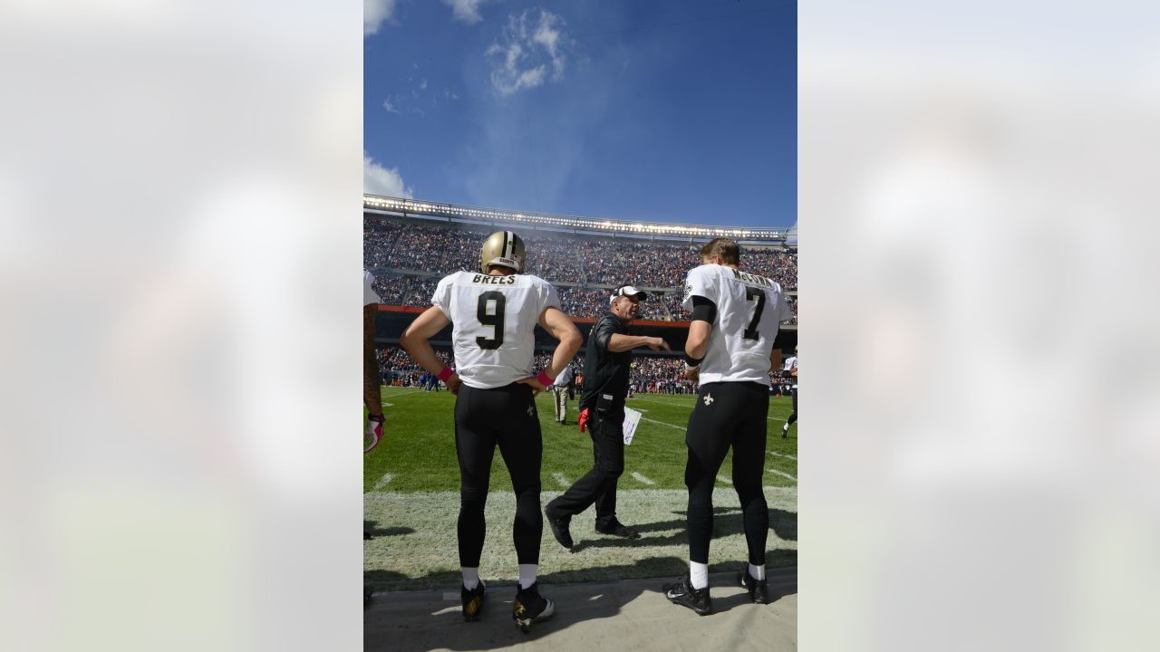 New Orleans Saints and former San Diego quarterback Drew Brees and General  Manager Mickey Loomis, right, hold a Saints jersey presented to Brees  during a news conference at the New Orleans Saints