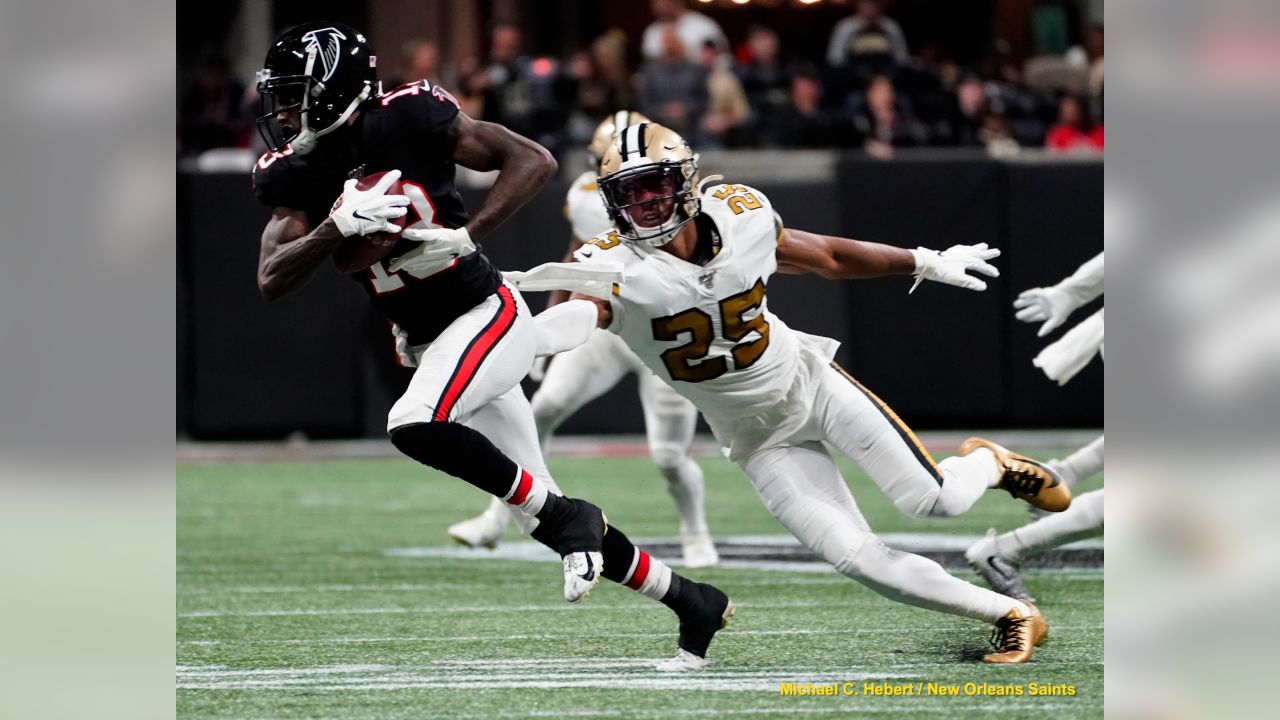 New Orleans Saints beat Atlanta Falcons 26-18 to capture third consecutive NFC  South title