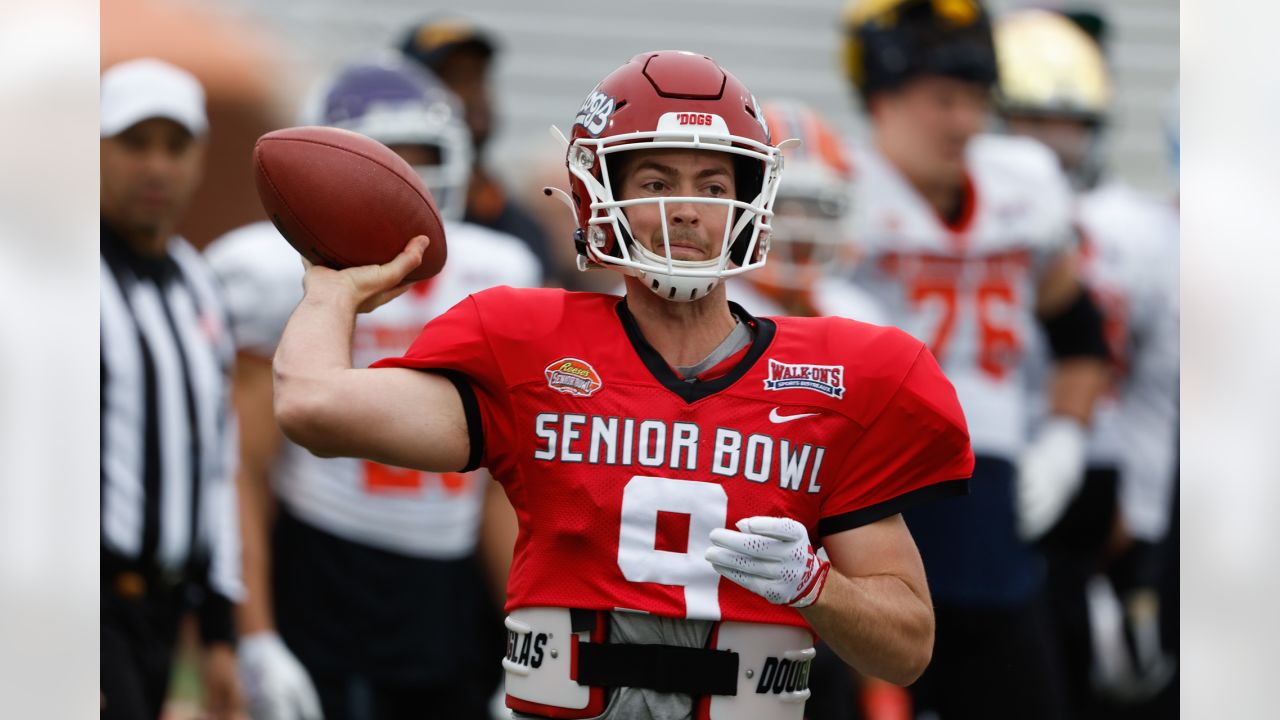 New Orleans Saints quarterback Jake Haener (14) runs through