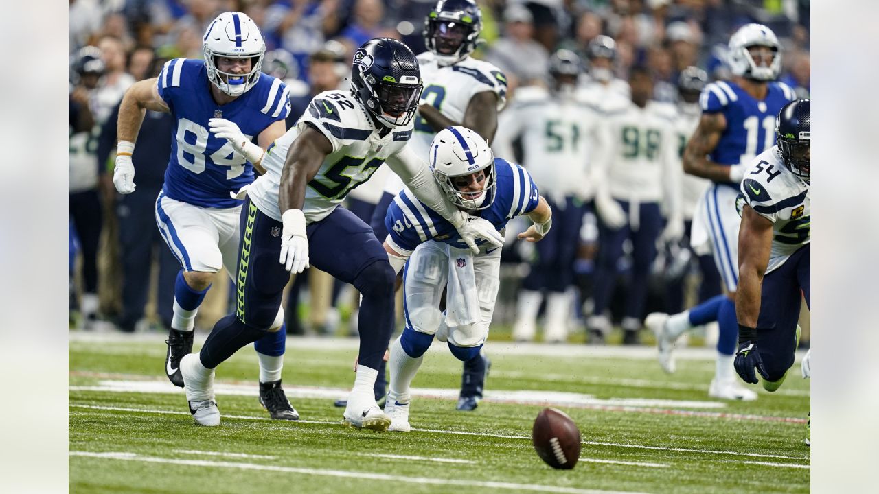 September 12, 2021: Seattle Seahawks running back Chris Carson (32) runs  with the ball during NFL football game action between the Seattle Seahawks  and the Indianapolis Colts at Lucas Oil Stadium in