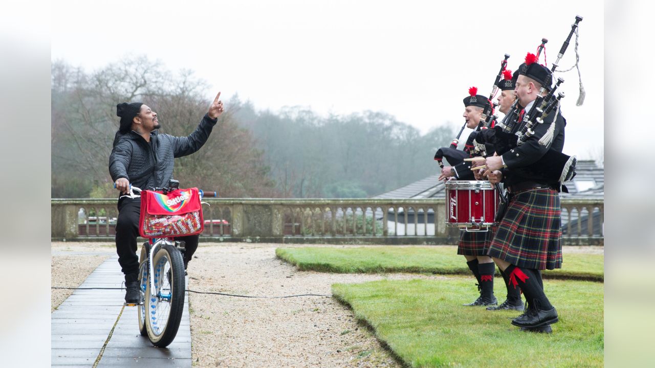 Marshawn Lynch Goes To Scotland, Plays Bagpipes, Rides a Bike And Hands Out  Skittles