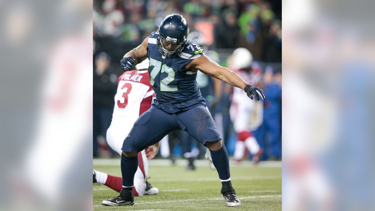 Seahawks' Michael Bennett skipping OTAs in bid for new contract, report  says