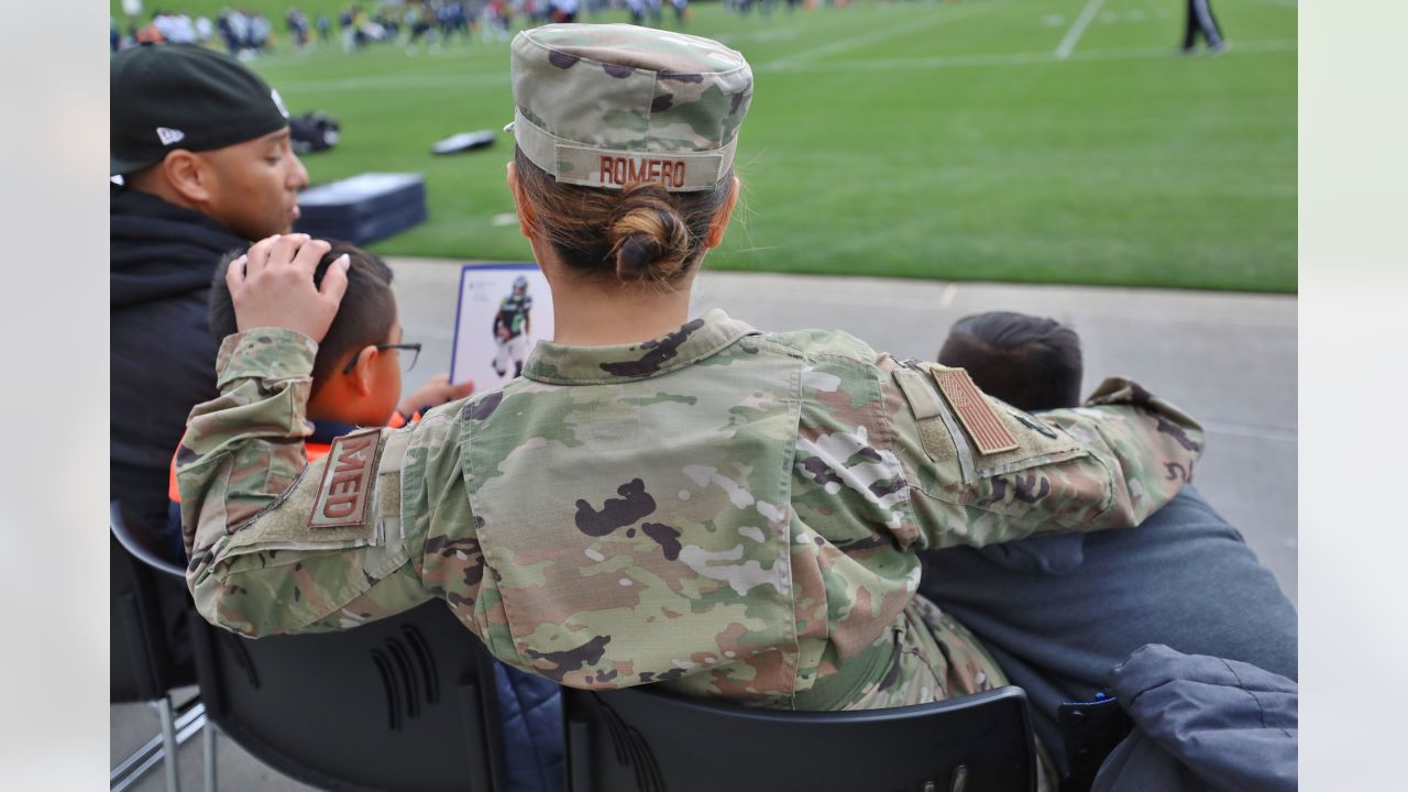 U.S. Military recruits are sworn in during halftime on Salute to Service  military appreciation day at an NFL football game between the Jacksonville  Jaguars and the Las Vegas Raiders, Sunday, Nov. 6