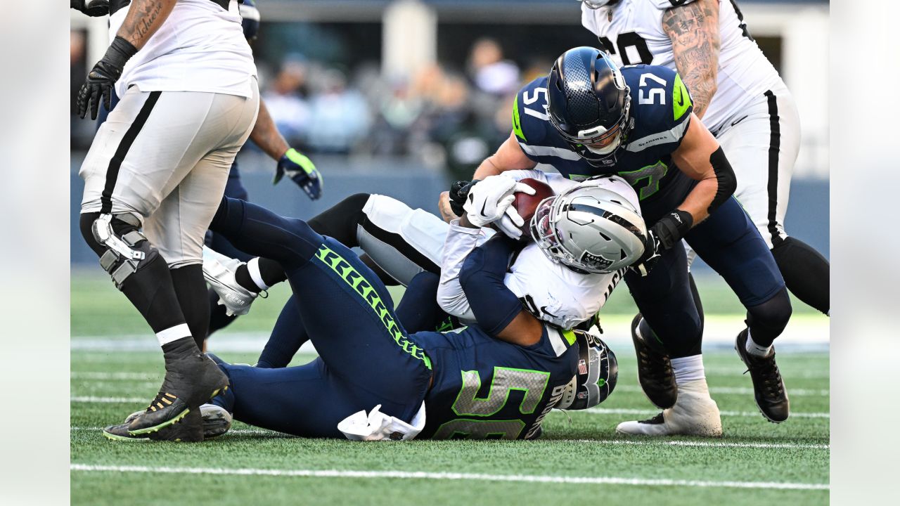 Arizona Cardinals running back Eno Benjamin (26) gets past Seattle Seahawks  linebacker Cody Barton (57) during an NFL Professional Football Game  Sunday, Jan. 9, 2022, in Phoenix. (AP Photo/John McCoy Stock Photo - Alamy