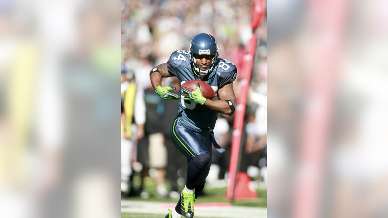 Seattle Seahawks' T.J. Houshmandzadeh, left, celebrates a touchdown  reception as Deion Branch looks on during the first half of an NFL football  game against the Jacksonville Jaguars, Sunday, Oct. 11, 2009, in