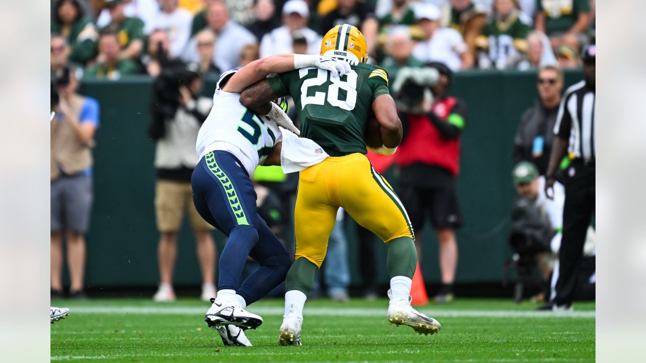 Seattle Seahawks defensive end Dre'Mont Jones (55) spikes the ball after a  teammate scored a touchdown during an NFL preseason game against the Green  Bay Packers Saturday, Aug. 26, 2023, in Green