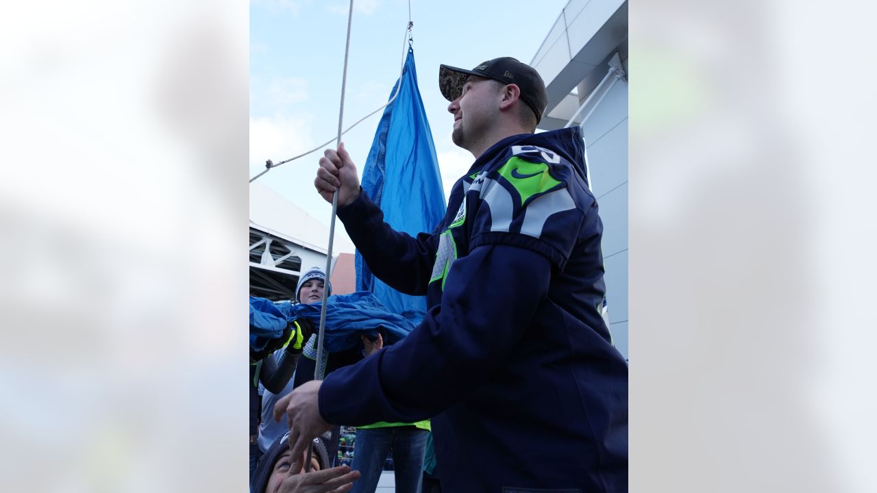 PHOTOS: Seattle Mariners Catcher Cal Raleigh Raises The 12 Flag