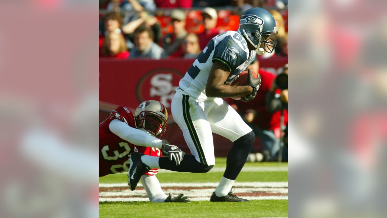 Seattle Seahawks wide receiver Darrell Jackson (82) celebrates in front of  Washington Redskins defensive back Ryan Clark, in back, after scoring a 29  yard touchdown in the second quarter during their NFC