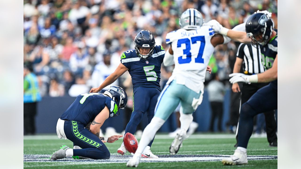 A fan waves a Dallas Cowboys flag before a preseason NFL football game  between the Seattle Seahawks and the Cowboys, Saturday, Aug. 19, 2023, in  Seattle. (AP Photo/Lindsey Wasson Stock Photo - Alamy