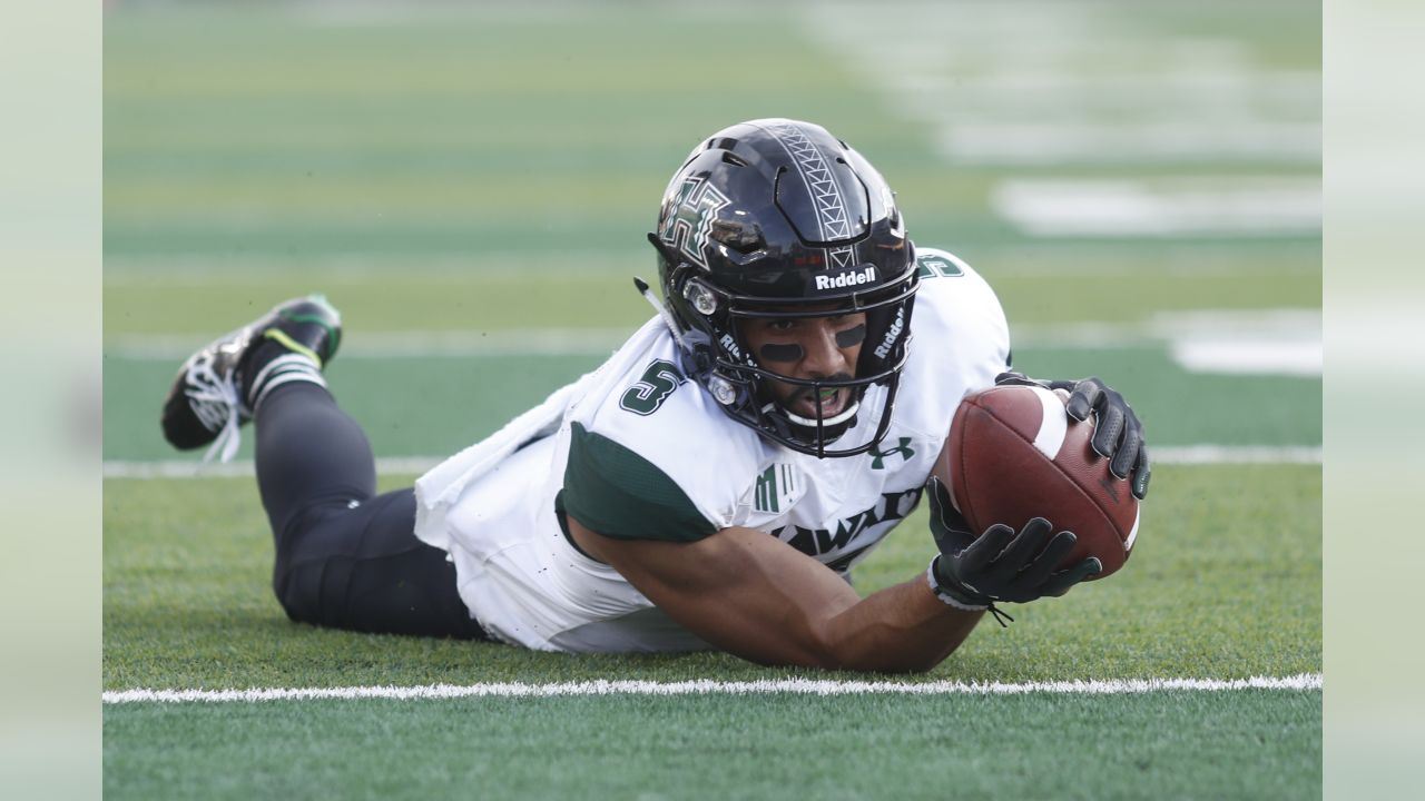 Hawaii wide receiver John Ursua (5) reaches toward the end zone as Wyoming  free safety Andrew Winged (28) during their game Saturday, Sept. 23, 2017.  (Josh Galemore/The Casper Star-Tribune via AP Stock