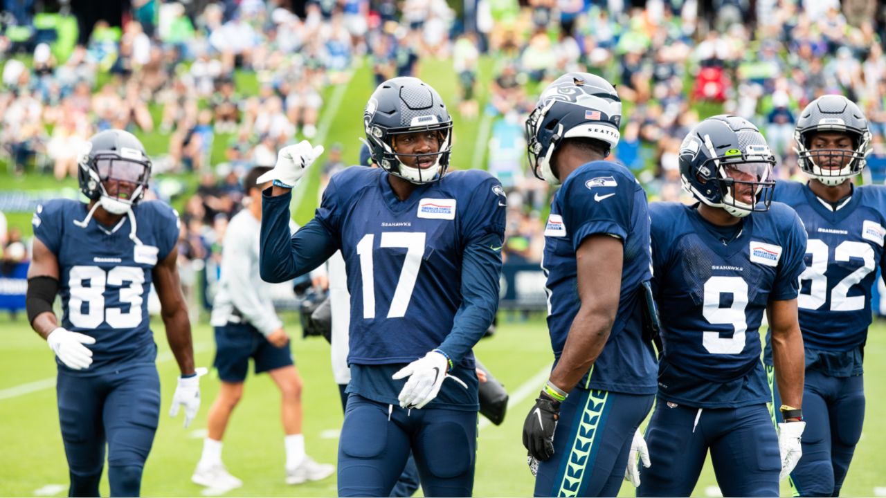 Seattle Seahawks wide receiver Jaron Brown, (18) celebrates with wide  receiver David Moore (83) after Brown caught a pass for a touchdown during  the second half of an NFL football game against