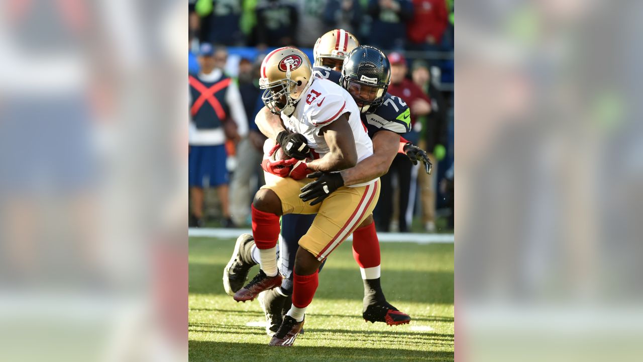 Seattle Seahawks vs. San Francisco 49ers. NFL Game. American Football  League match. Silhouette of professional player celebrate touch down.  Screen in Stock Photo - Alamy