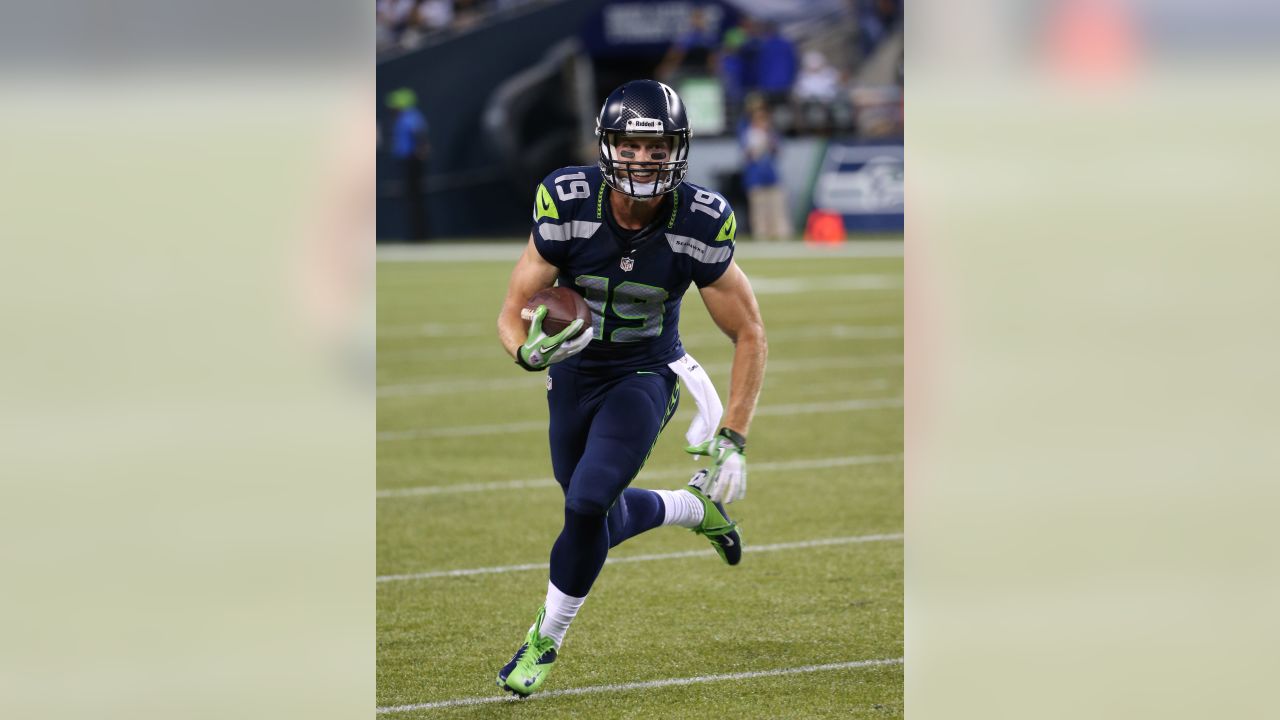 Larry Wales, of Seattle, wears the #14 jersey of Seattle Seahawks