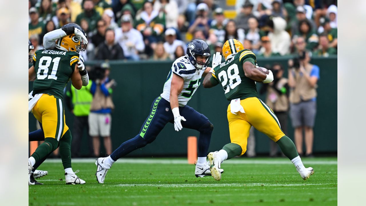 Seattle Seahawks defensive end Dre'Mont Jones (55) spikes the ball after a  teammate scored a touchdown during an NFL preseason game against the Green  Bay Packers Saturday, Aug. 26, 2023, in Green