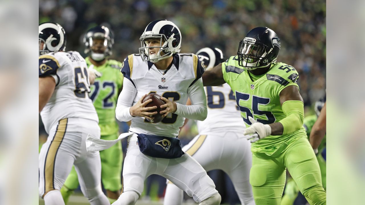 Seattle Seahawks wide receiver Tyler Lockett (16) is wrapped by Los Angeles  Rams Kickoff team during the first quarter at CenturyLink Field on October  7, 2018 in Seattle, Washington. The Rams beat