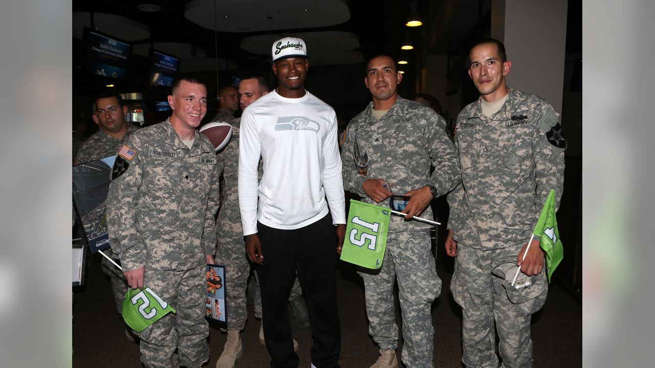 446th AW passes Seahawks' 12th-Man flag to Coast Guard > 446th Airlift Wing  > News