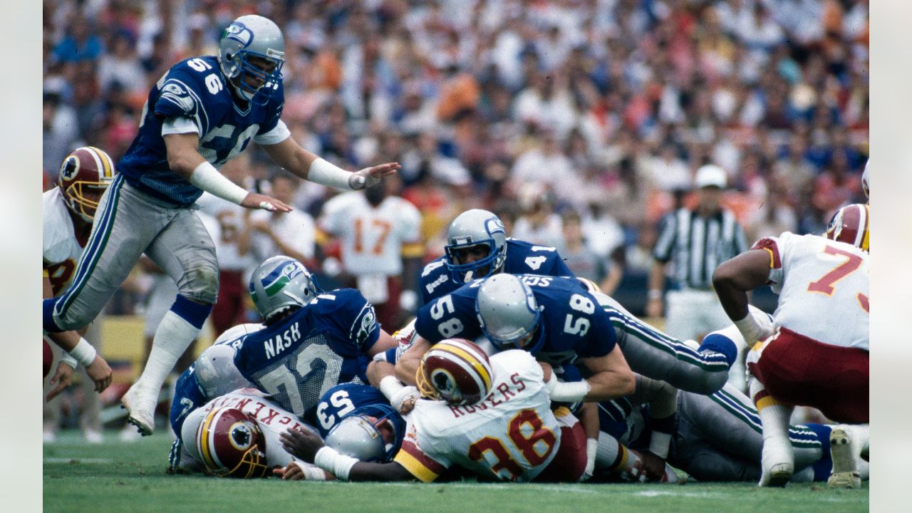 Washington Redskins halfback Chris Cooley is tackled by Seattle Seahawks  strong safety Michael Boulware in the second quarter during their NFC  divisional playoff football game in Seattle, Saturday, Jan. 14, 2006. (AP