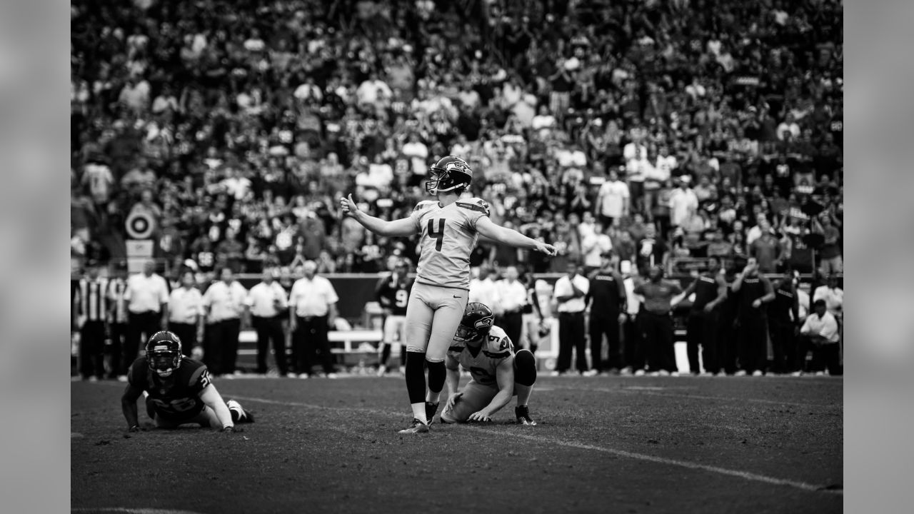 Kicker Steven Hauschka (4) and holder Jon Ryan (9) of the Seattle Seahawks  celebrate his game-winning field goal in a 23-20 overtime loss to the Seattle  Seahawks on Sunday, September 29, 2013