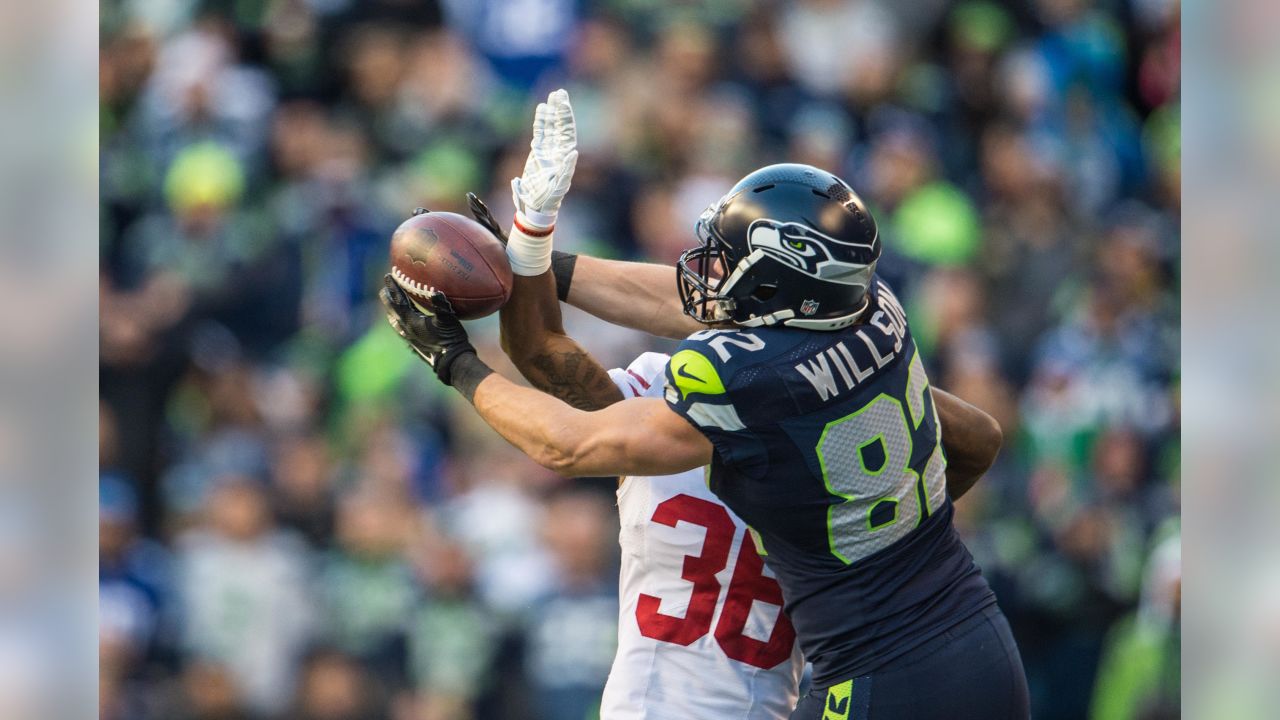 San Francisco 49ers vs. Seattle Seahawks. NFL Game. American Football  League match. Silhouette of professional player celebrate touch down.  Screen in Stock Photo - Alamy