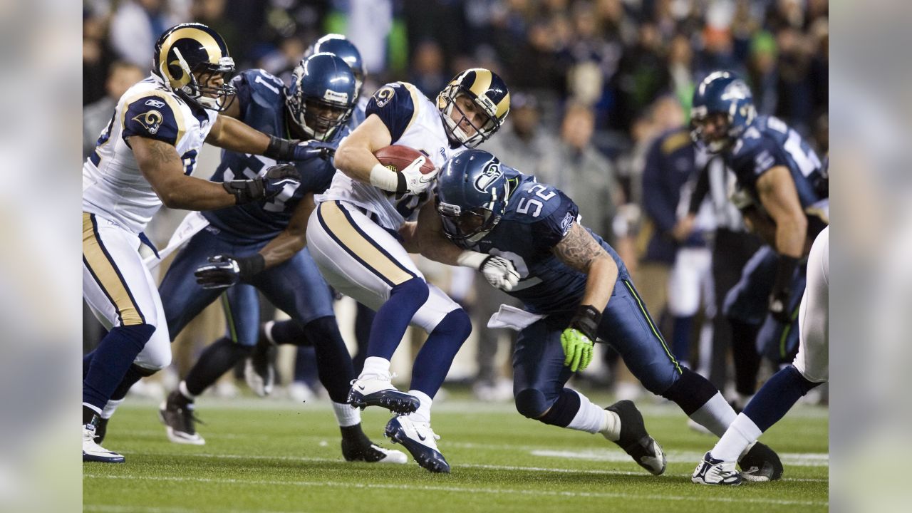 Seattle Seahawks' quarterback Charlie Whitehurst (L) watches a pass  completion to running back Justin Forsett against the St. Louis Rams in the  first quarter of the NFL's Western Division Championship game on