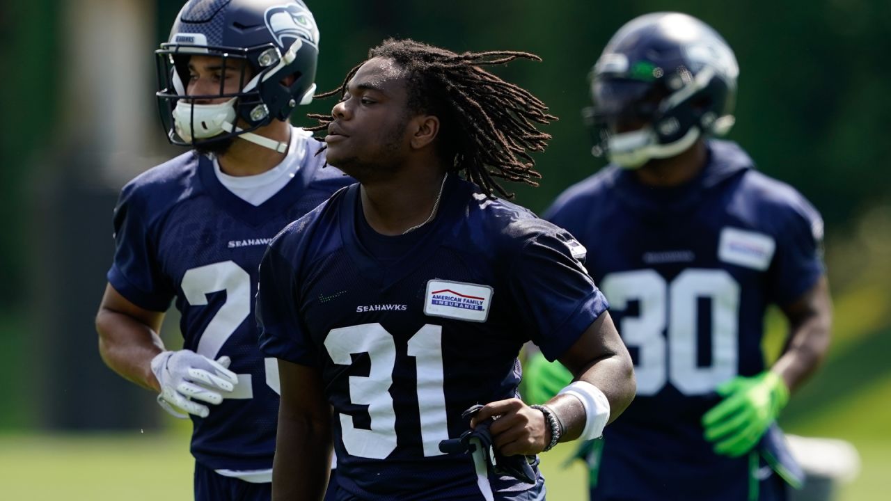 Seattle Seahawks running back DeeJay Dallas (31) returns a kick