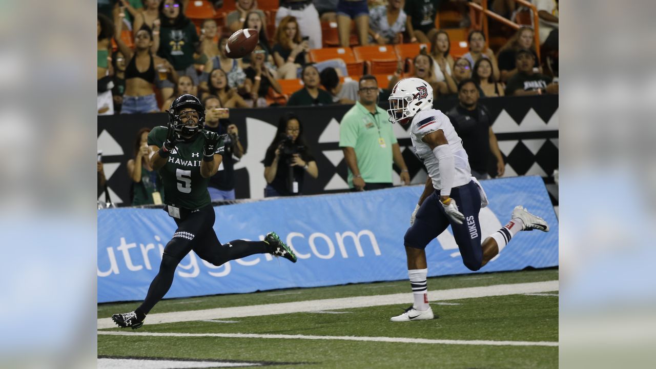 Hawaii wide receiver John Ursua (5) reaches toward the end zone as Wyoming  free safety Andrew Winged (28) during their game Saturday, Sept. 23, 2017.  (Josh Galemore/The Casper Star-Tribune via AP Stock