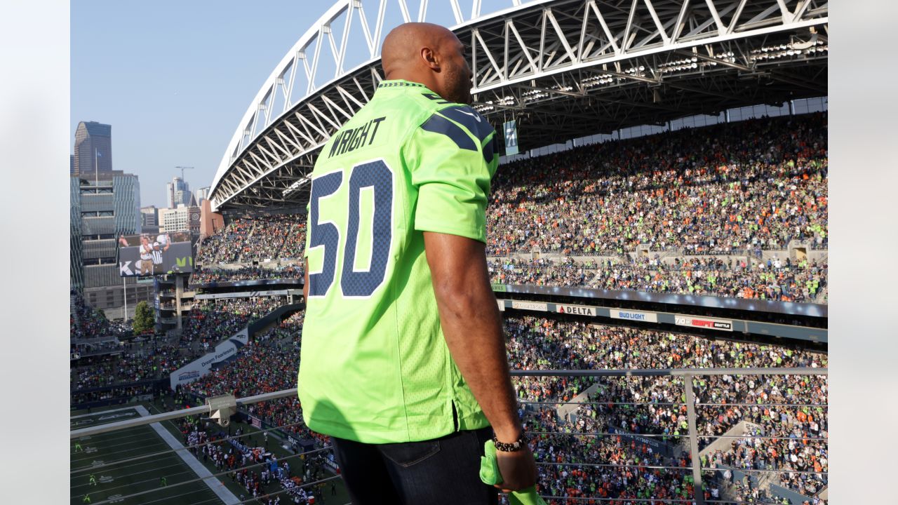 PHOTOS: Seahawks Legend K.J. Wright Raises The 12 Flag