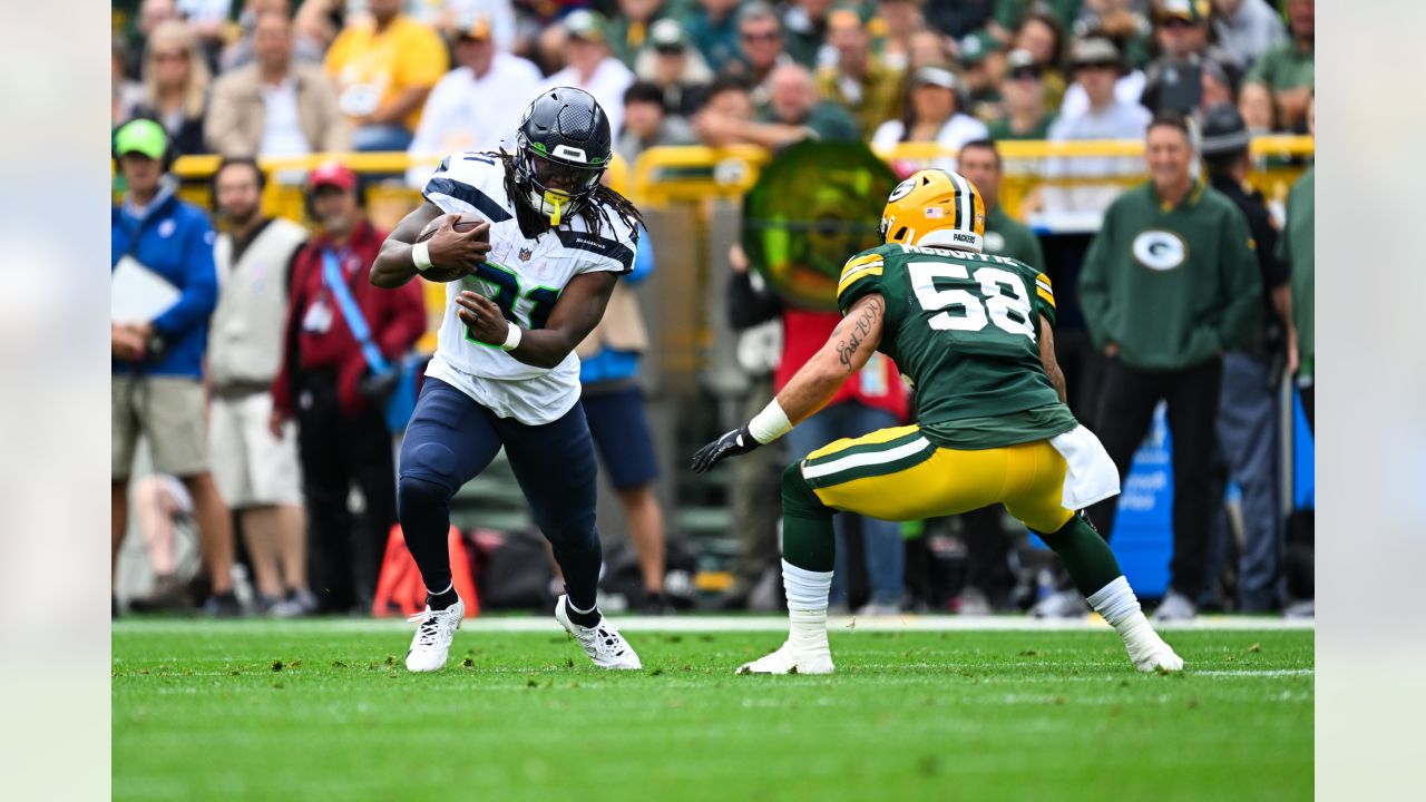 Seattle Seahawks defensive end Dre'Mont Jones (55) spikes the ball after a  teammate scored a touchdown during an NFL preseason game against the Green  Bay Packers Saturday, Aug. 26, 2023, in Green