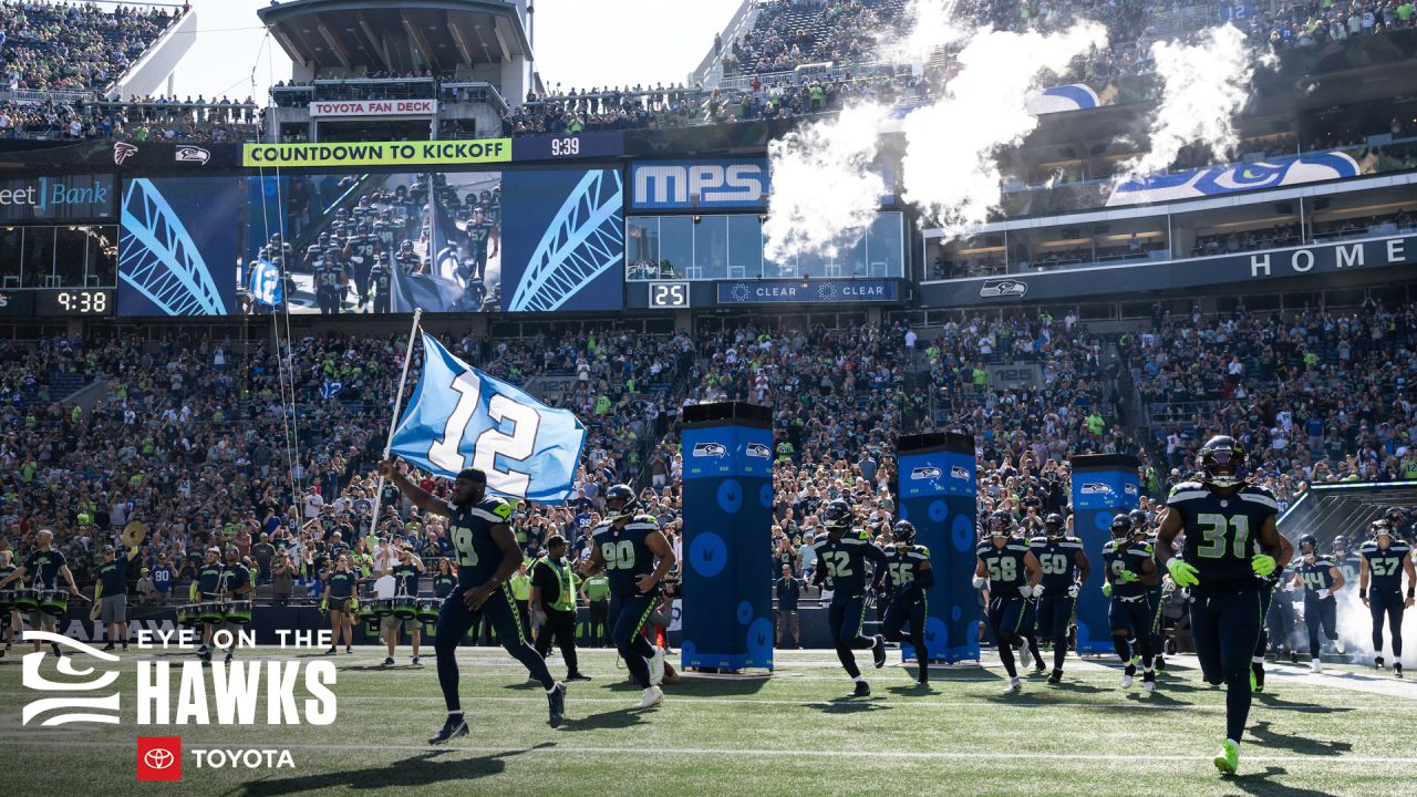 Seahawks LB Darrell Taylor runs onto the field after an interception,  giving Seattle a real 12th man 